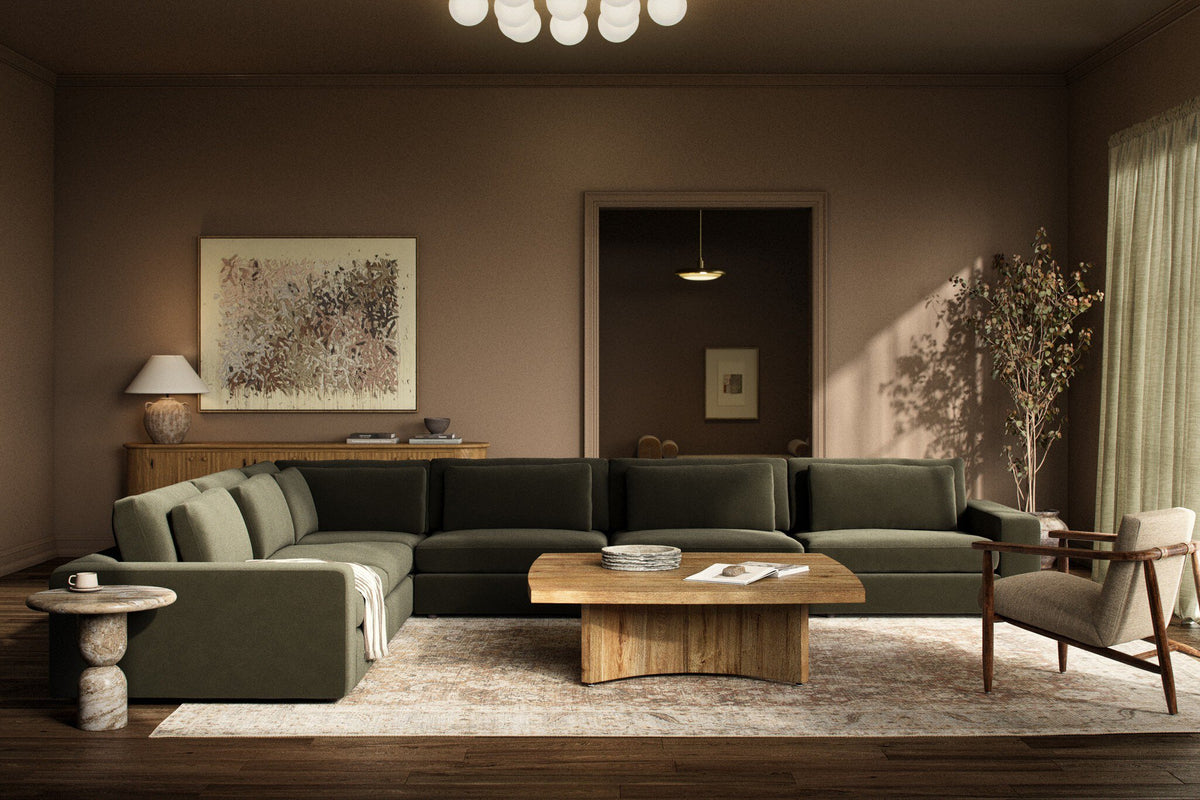 a living room with a large couch and a coffee table