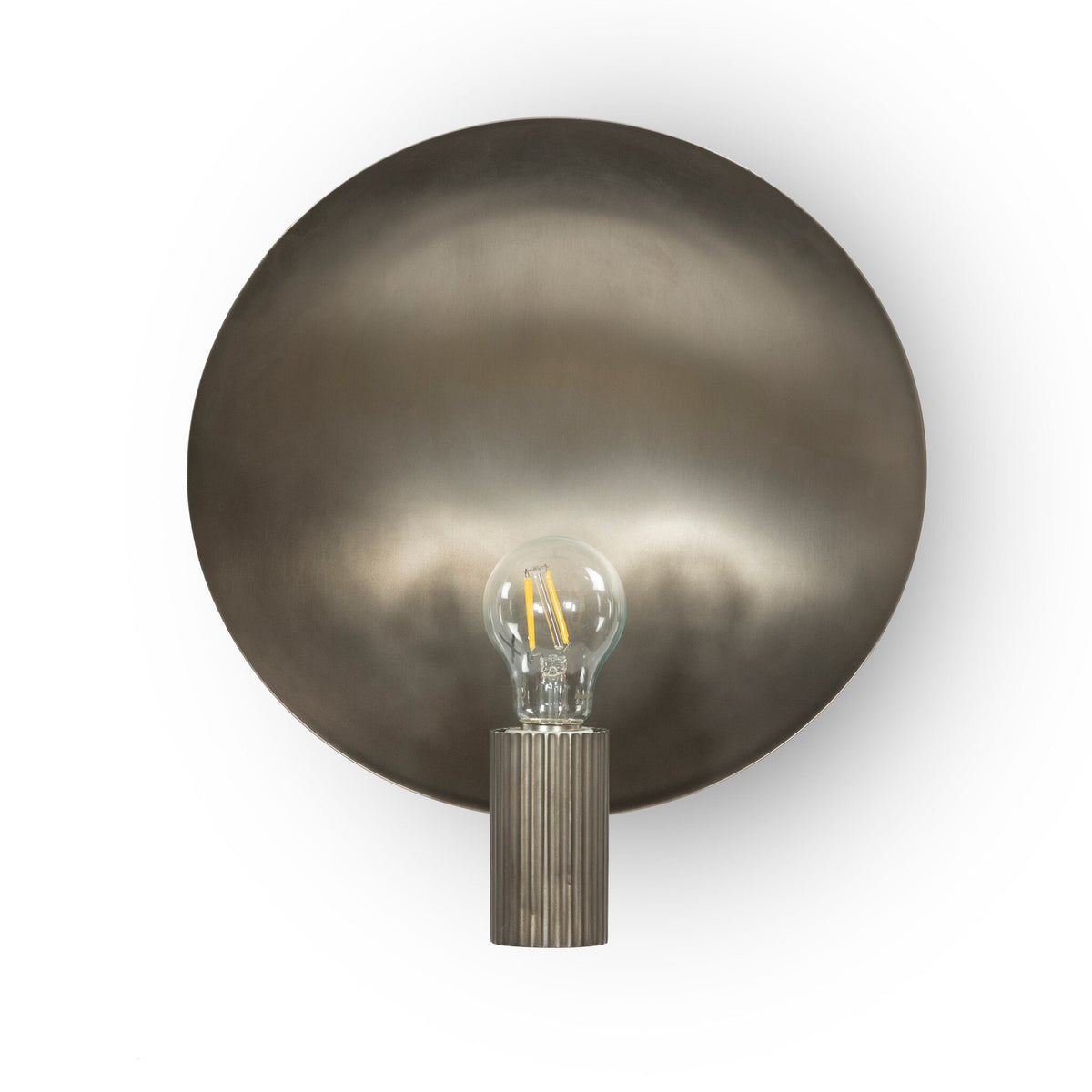 a light bulb on a round metal object