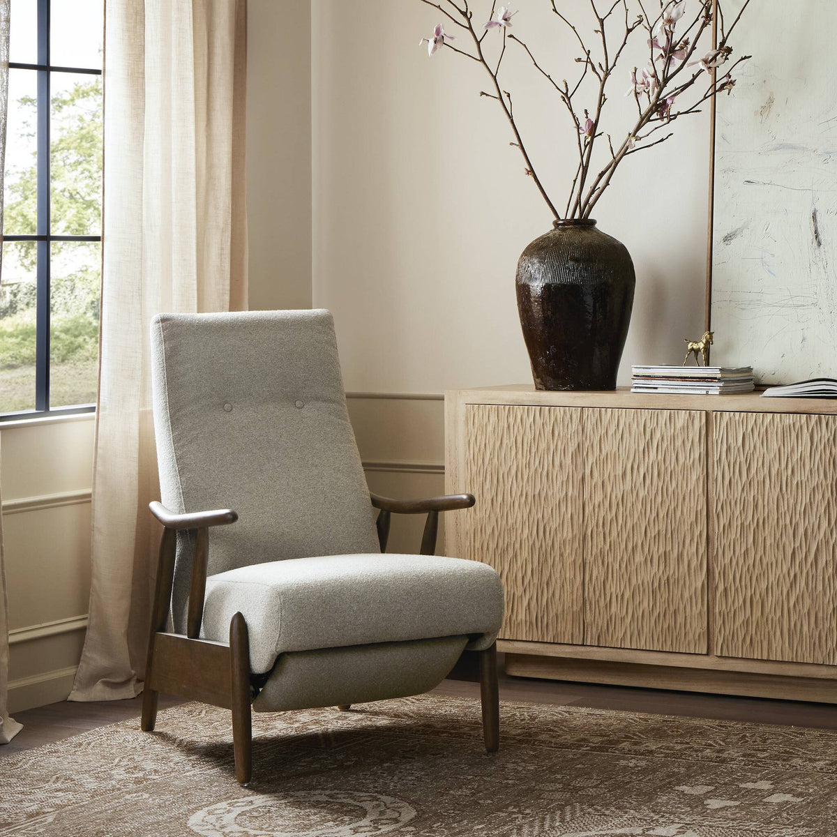 a chair next to a cabinet