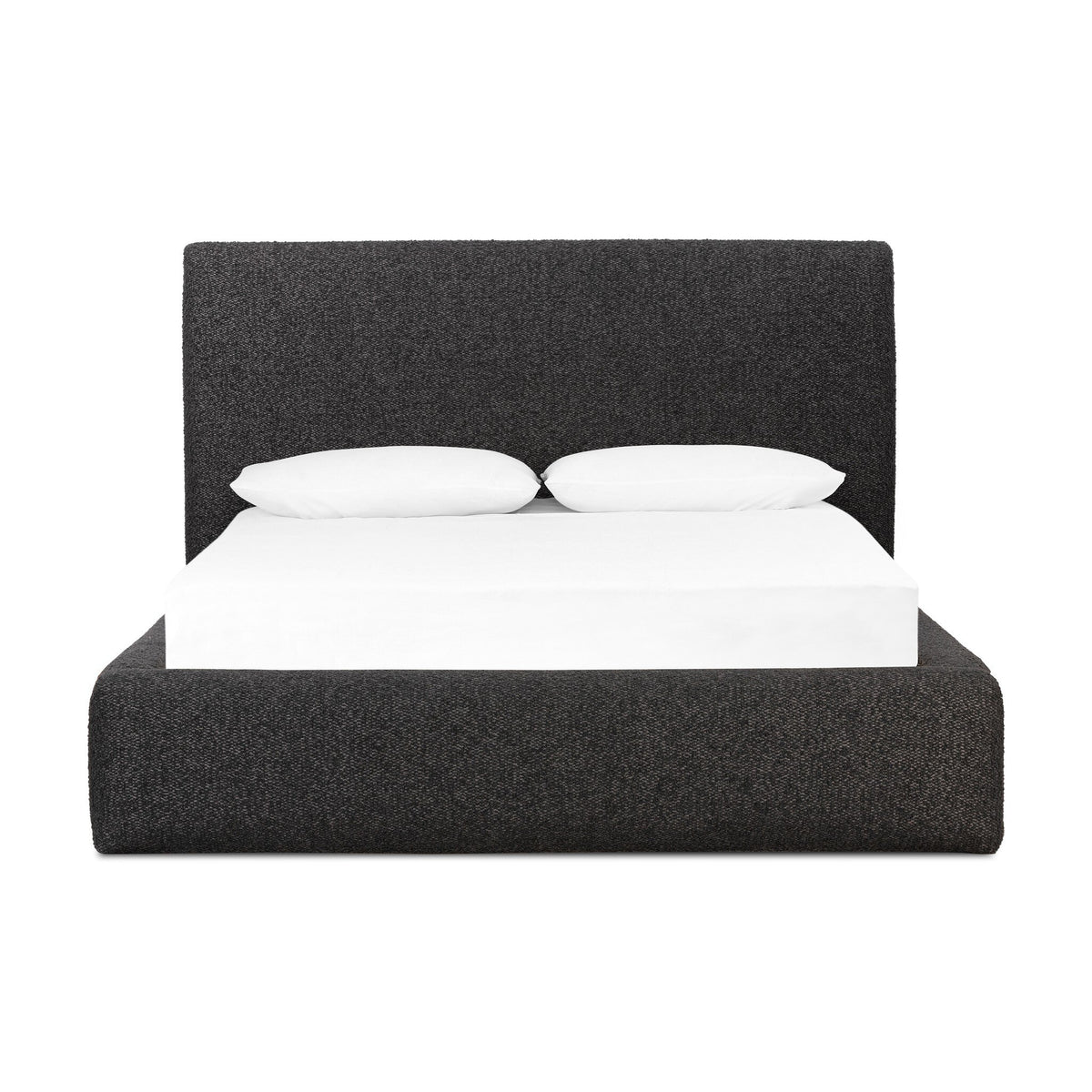 a bed with white sheets and pillows