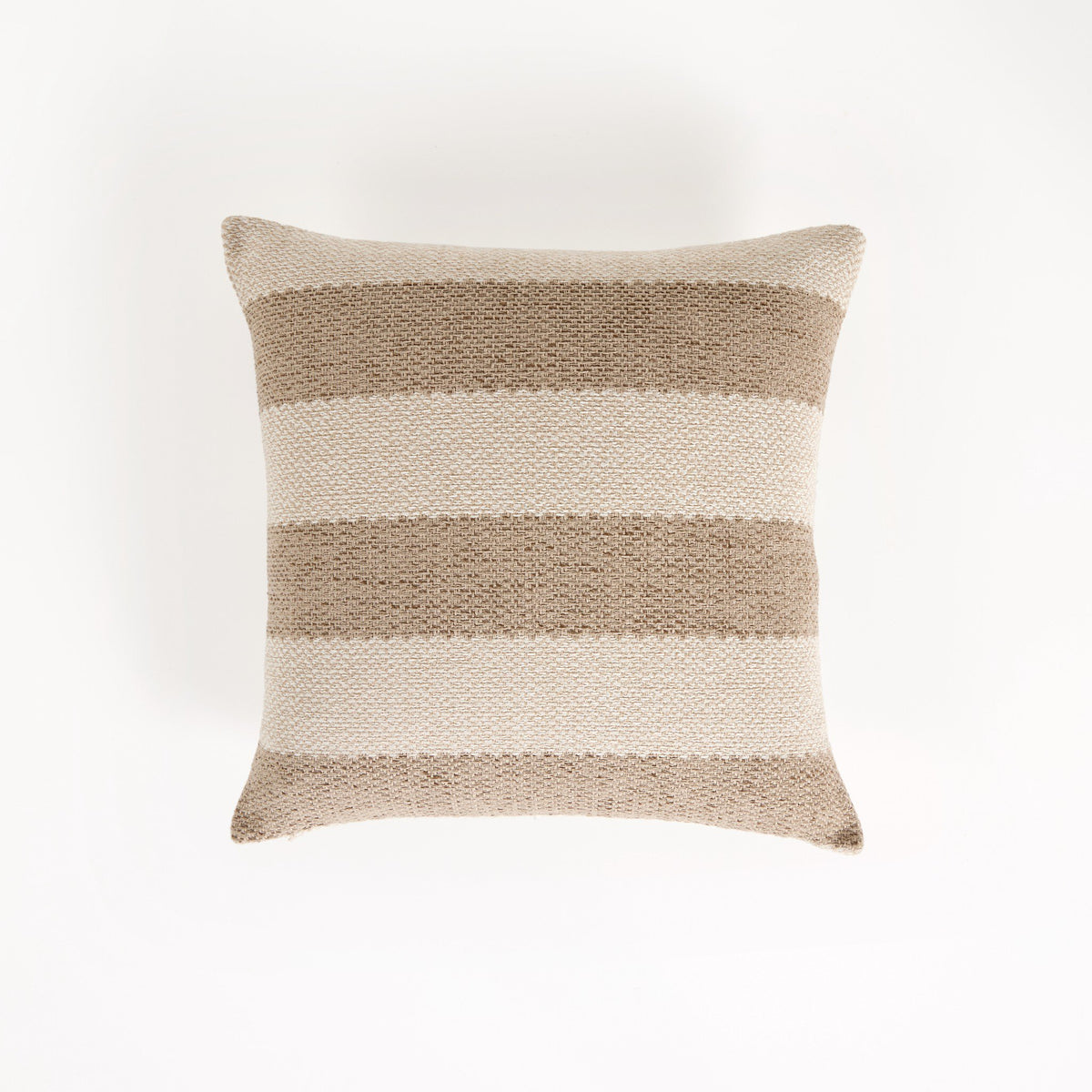 a pillow on a white surface