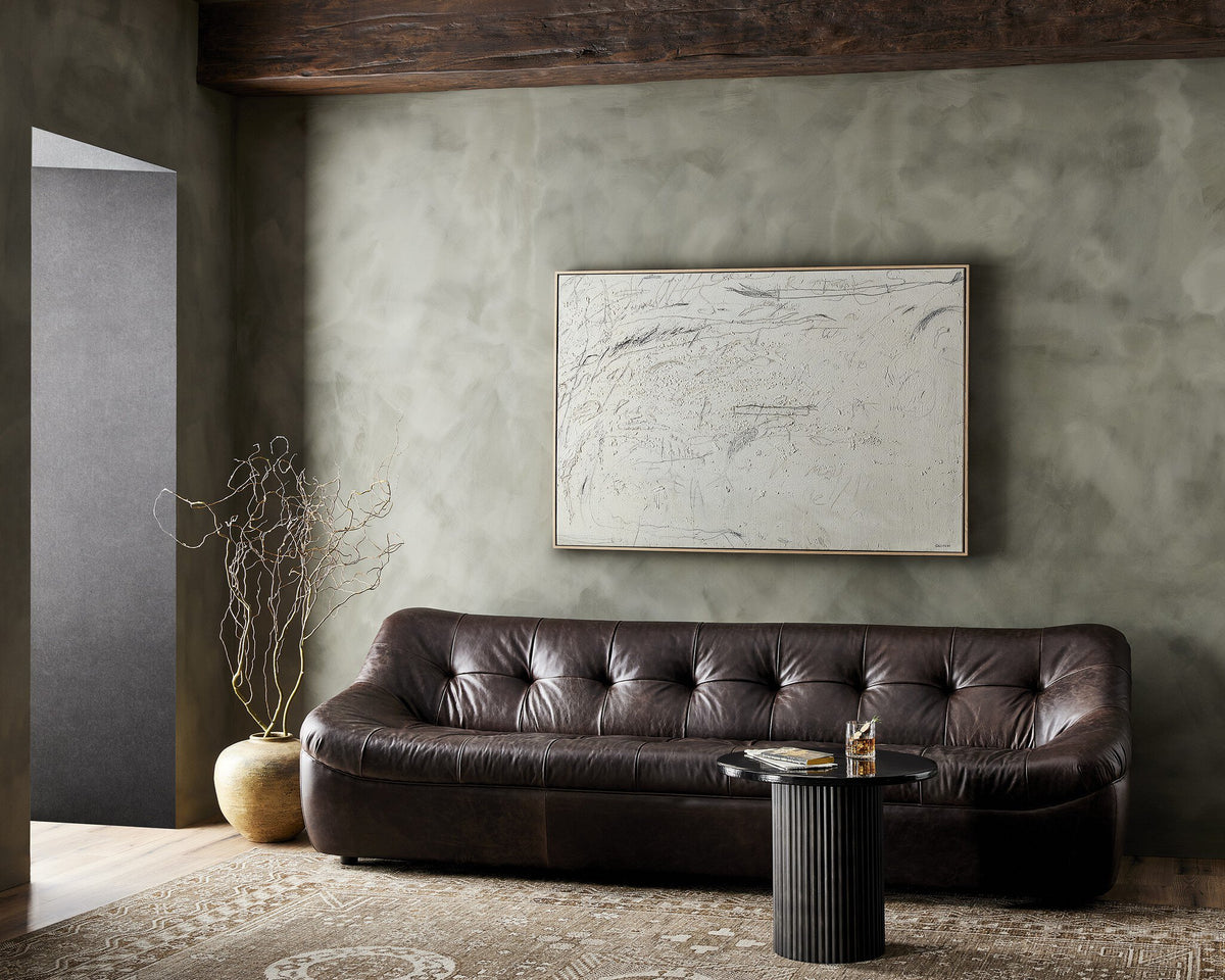 a brown couch in a room