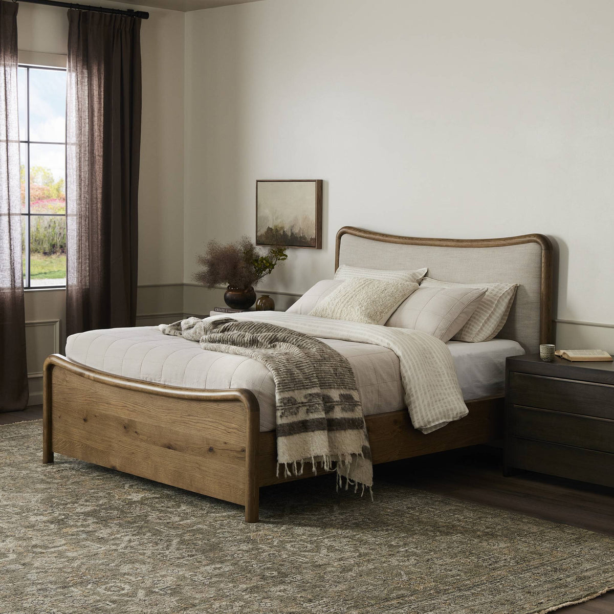 a bed with a rug and a window