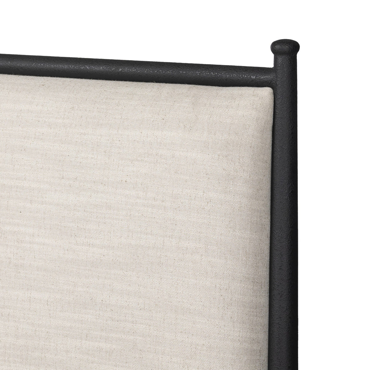 a close up of a white fabric headboard