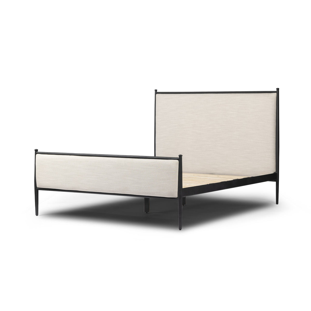 a bed with a white headboard