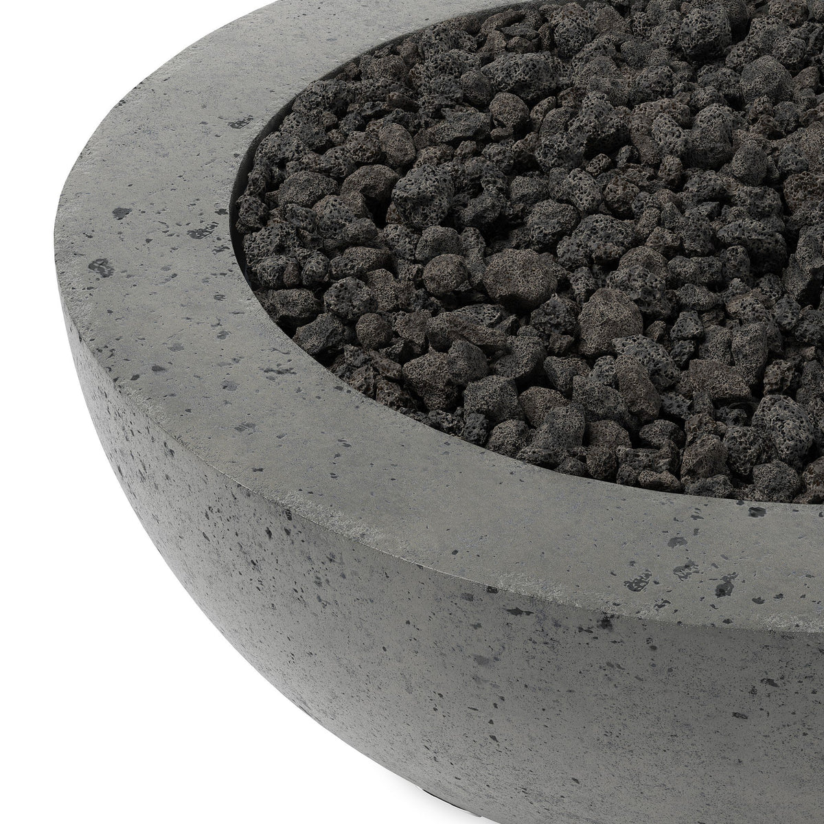a round stone bowl with black rocks