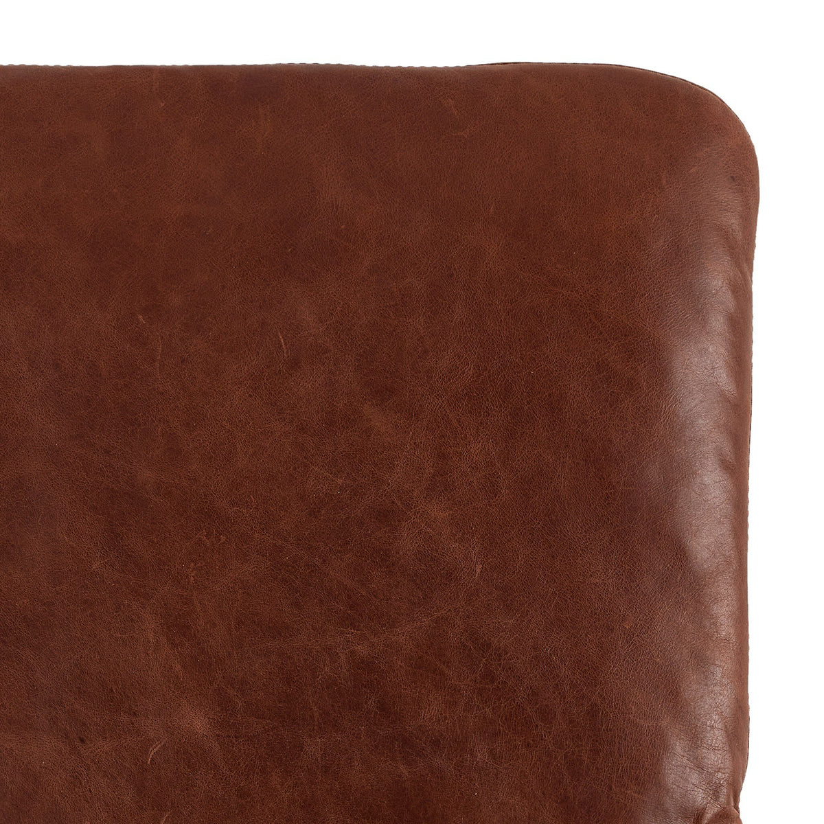 a close up of a brown leather cushion