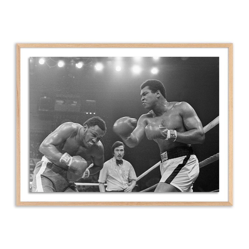Muhammad Ali Punching Joe Frazier By Getty Images
