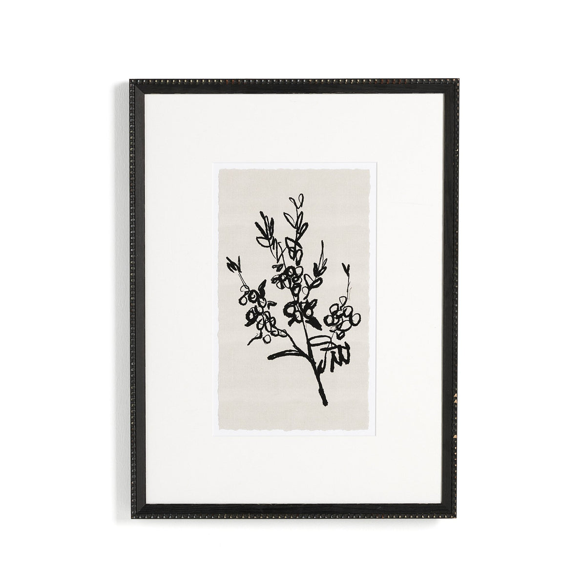 a black framed picture of a plant