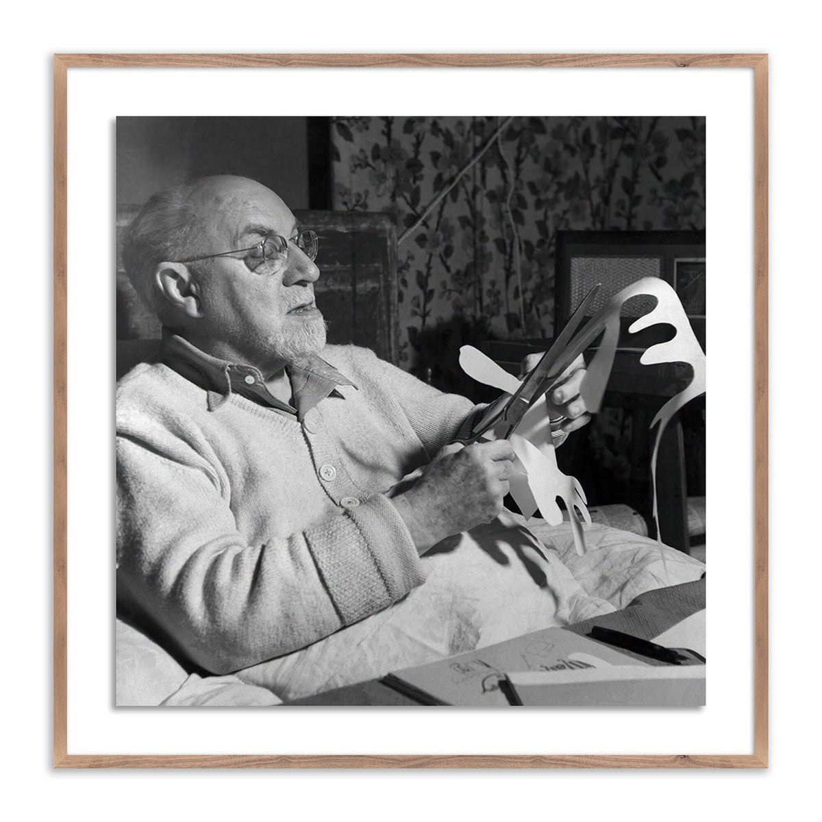 a man holding a paper