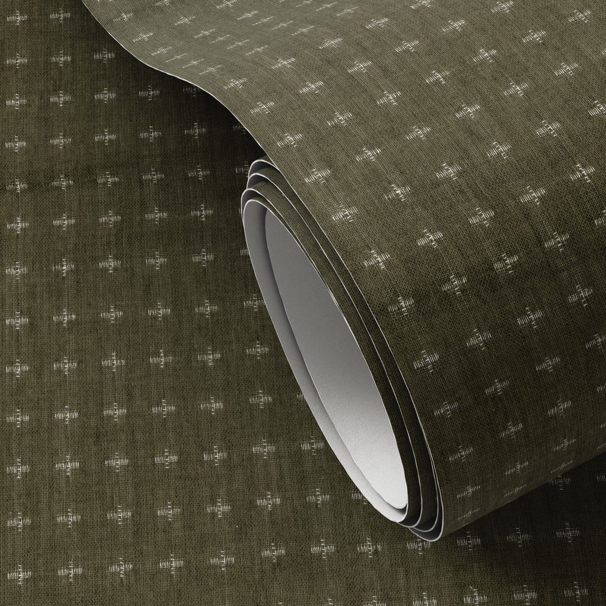 a roll of fabric with white dots