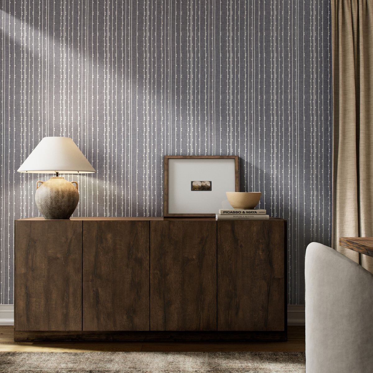 a room with a cabinet and a lamp