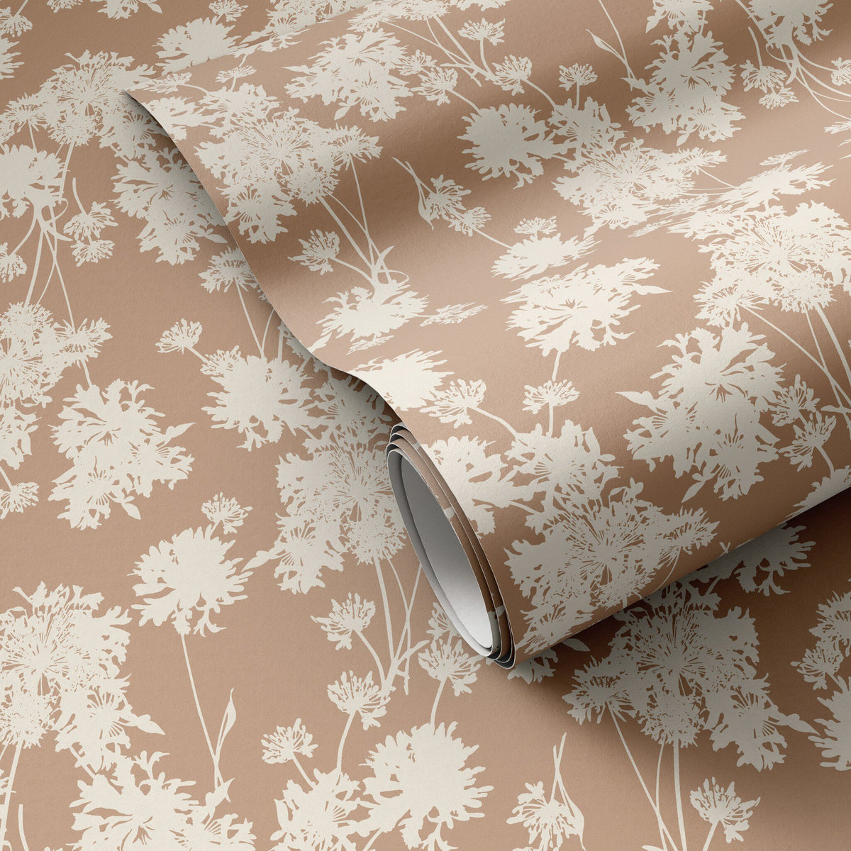 a roll of wallpaper on a brown surface