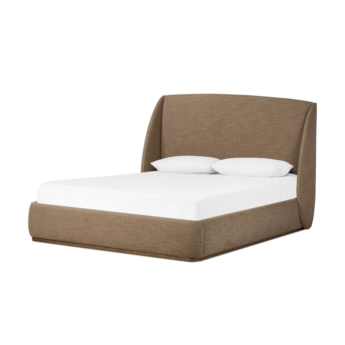 a bed with a white sheet and pillows