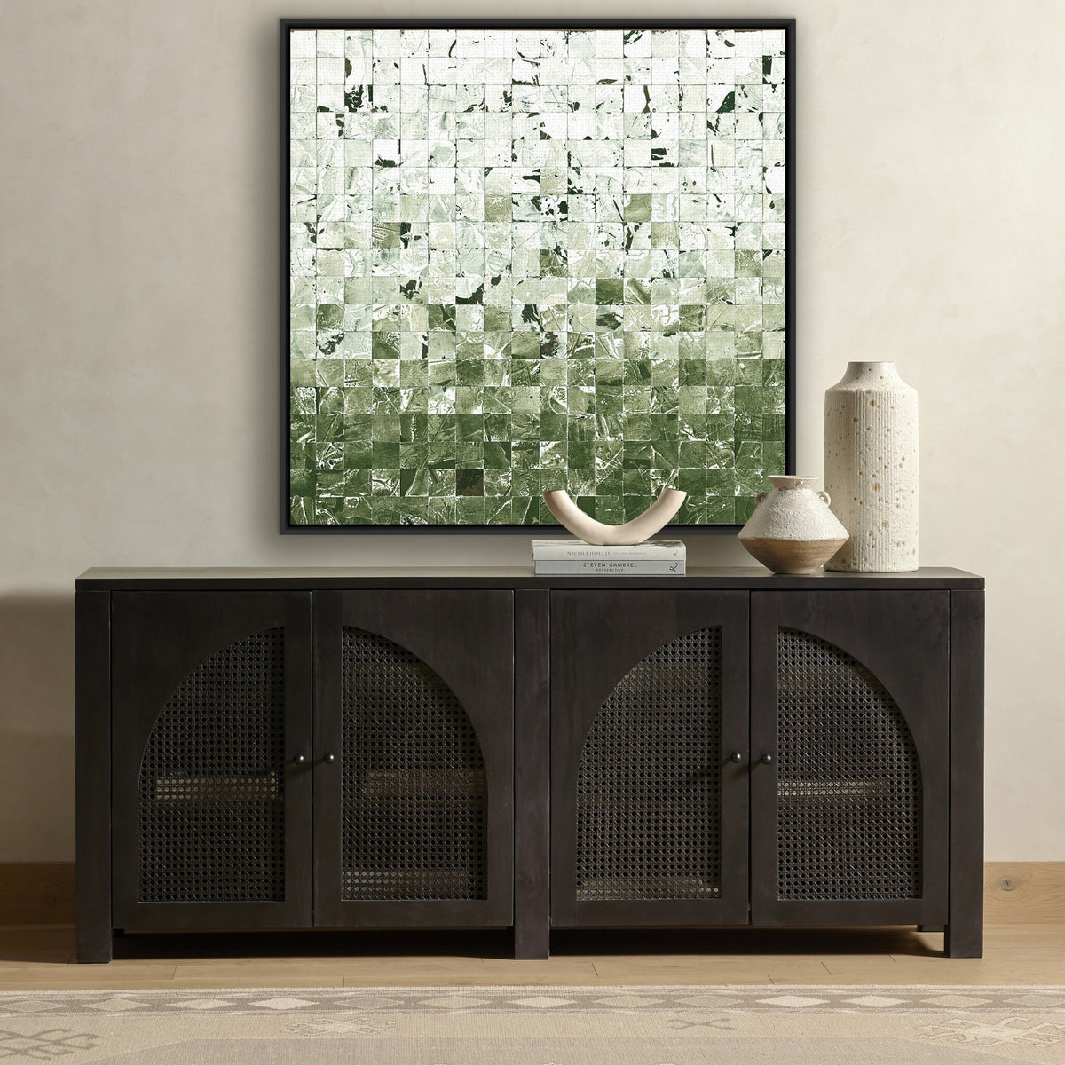 a black cabinet with a black frame and a painting on the wall