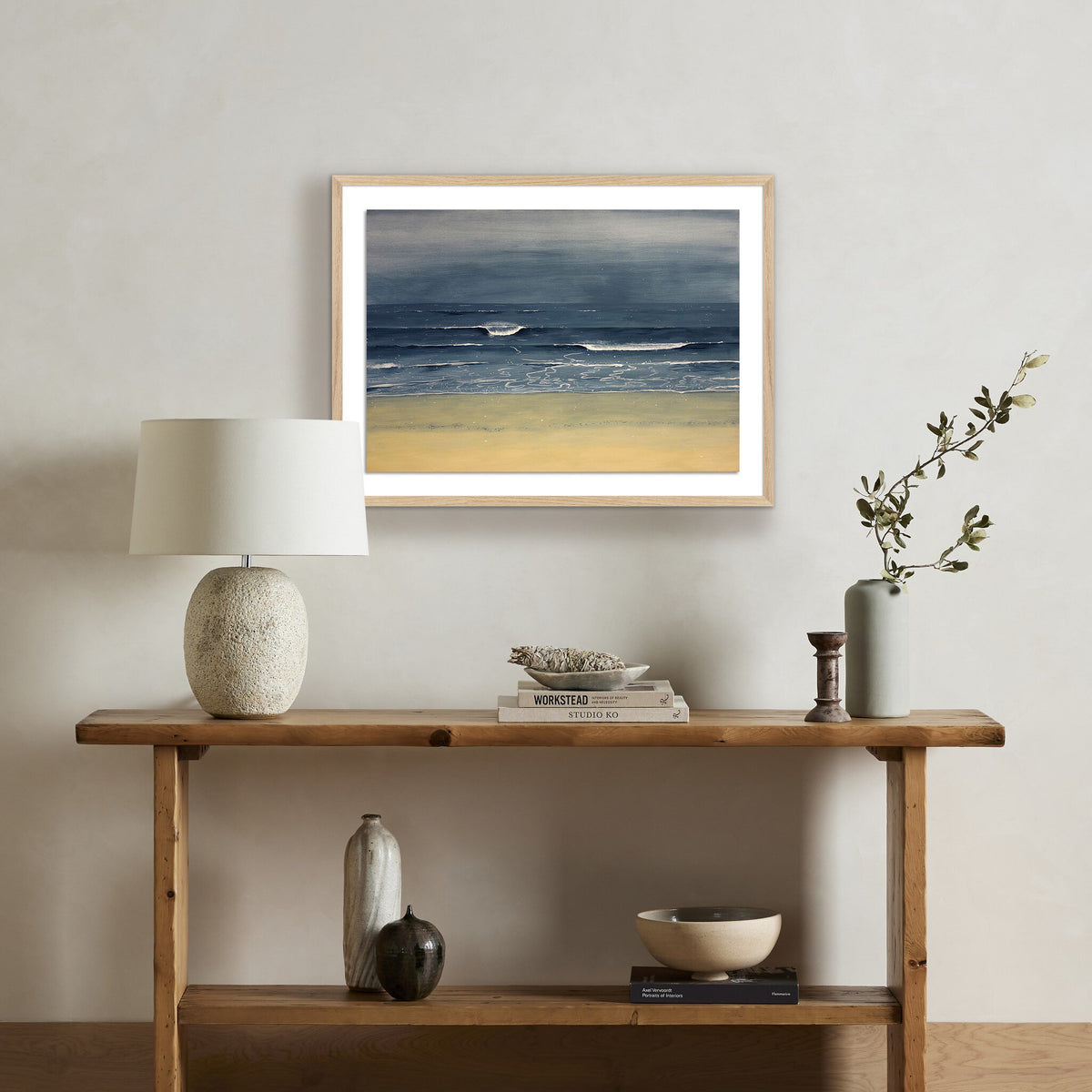 a shelf with a painting on the wall