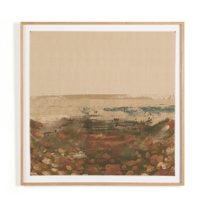 a framed art piece on a white wall