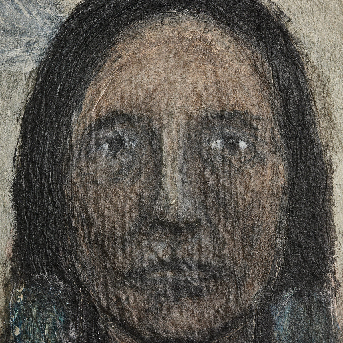 a close up of a face with Hellfire Caves in the background