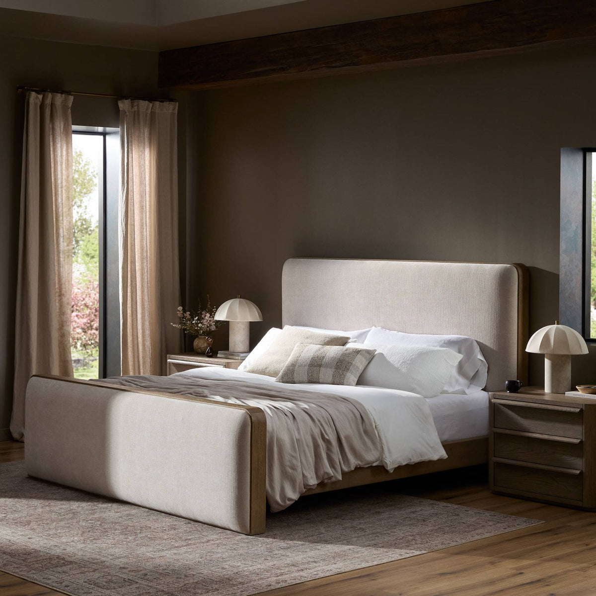 a bedroom with a bed and a rug