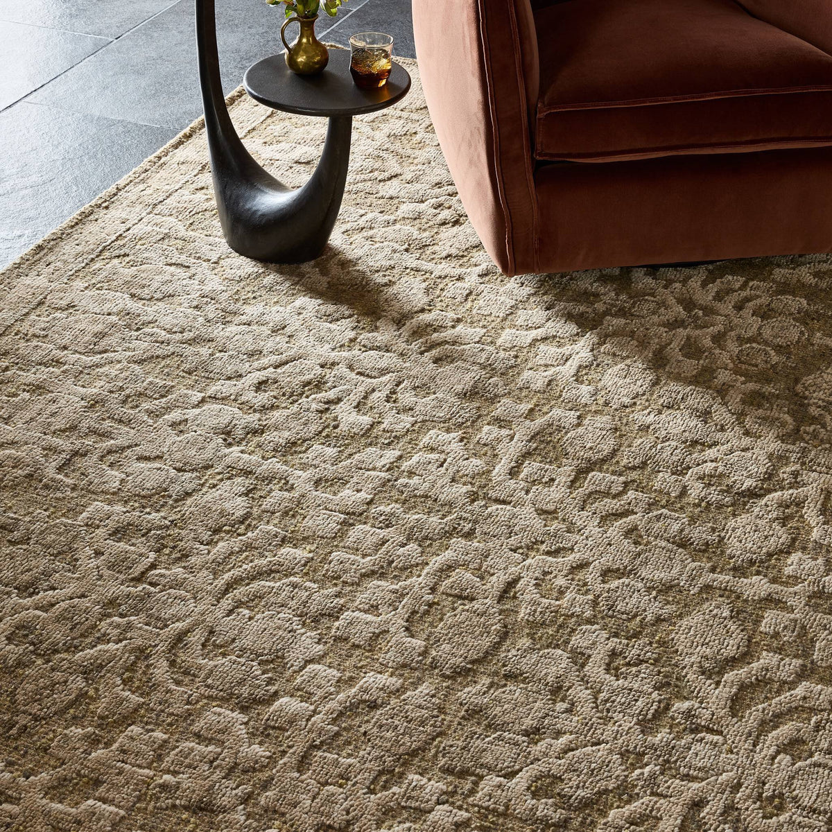 a brown rug with a black object on it