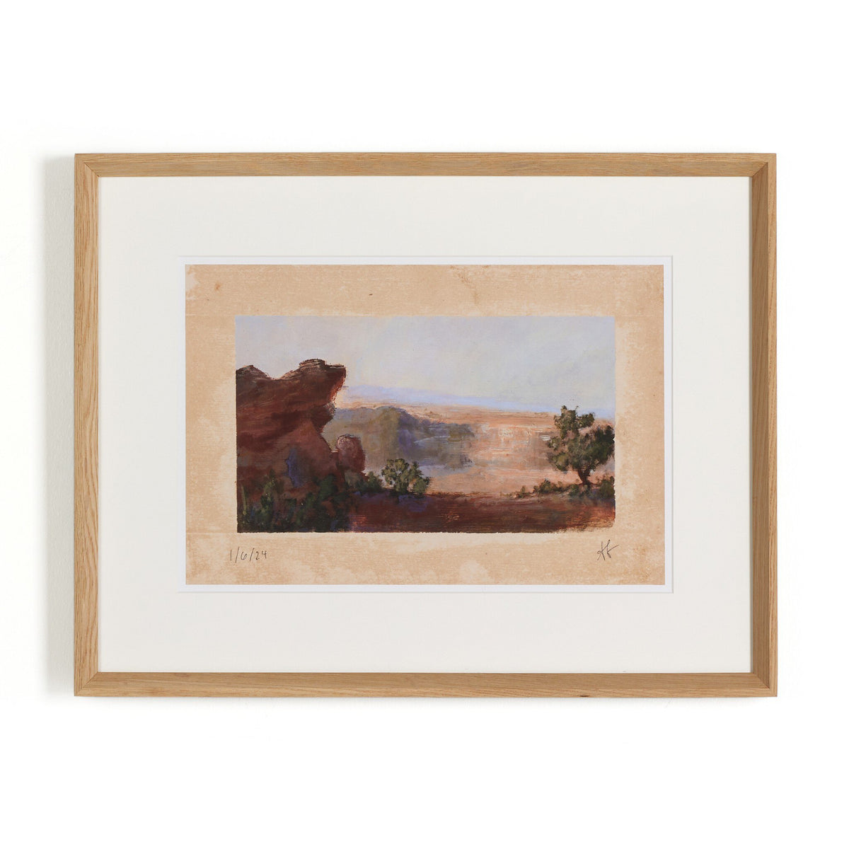 a framed painting of a landscape