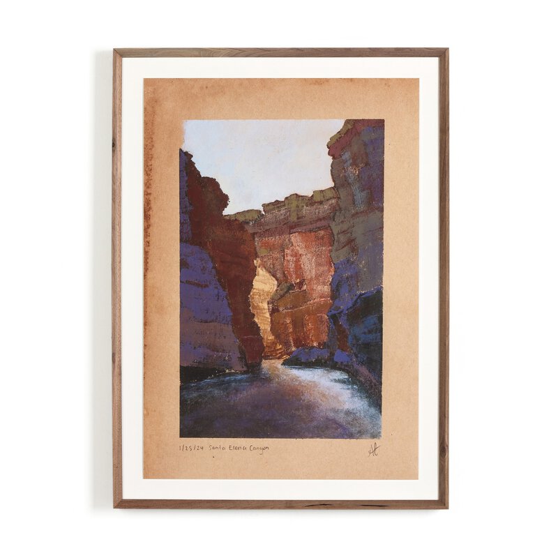 a framed picture of a canyon