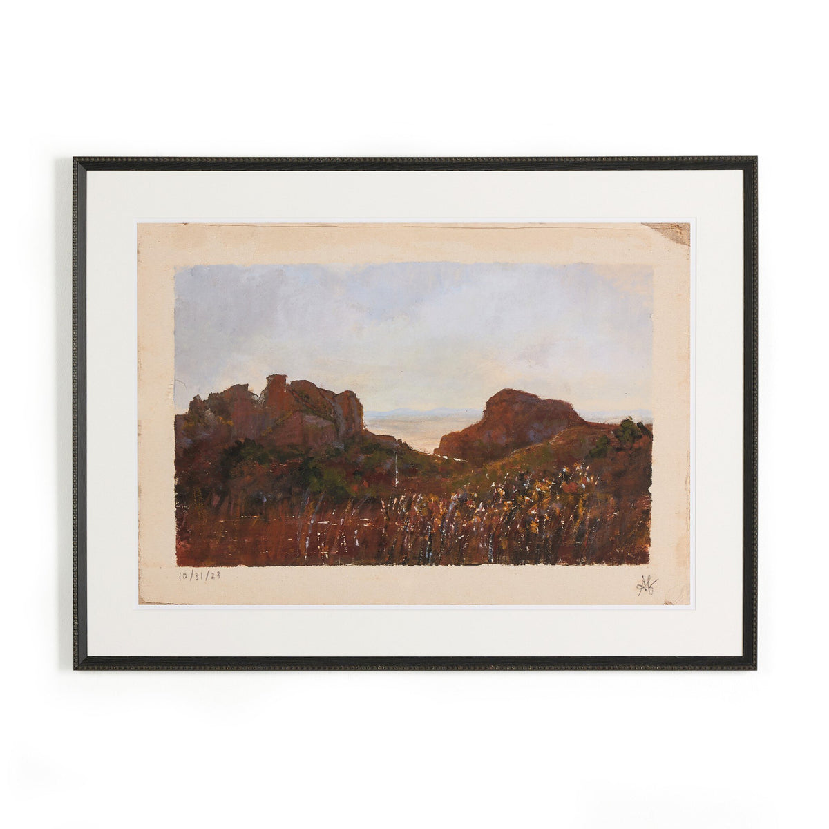 a framed painting of a landscape