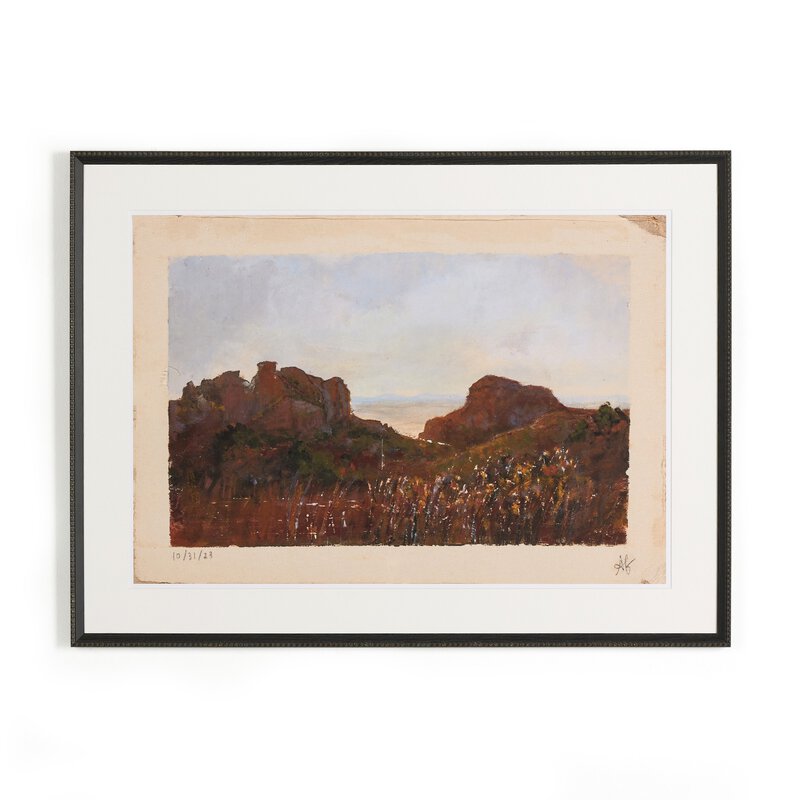 a framed painting of a landscape