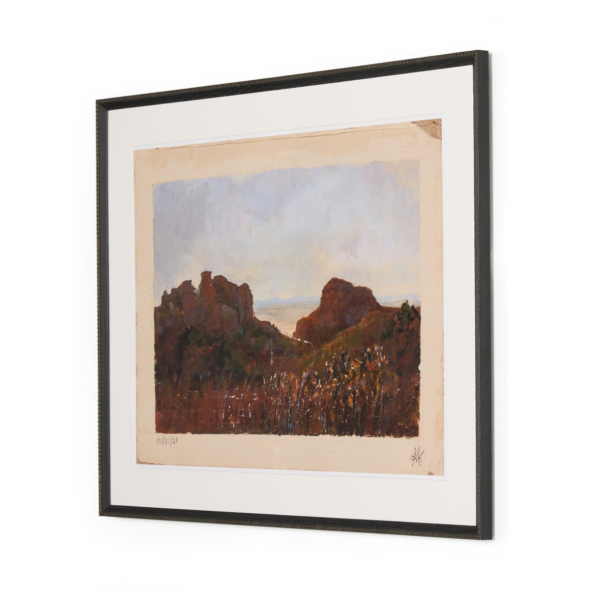 a framed painting of a landscape