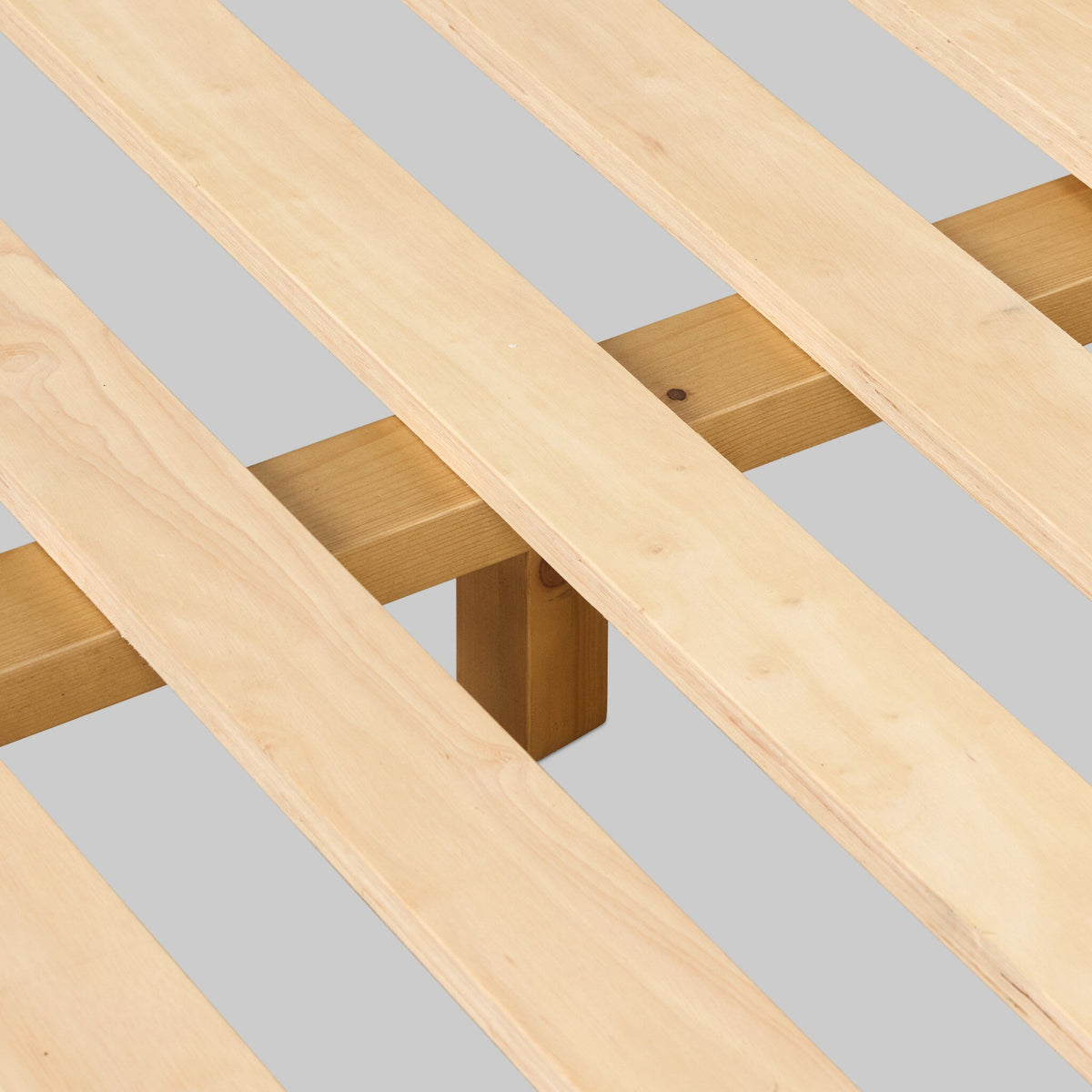 a wooden slat on a bed