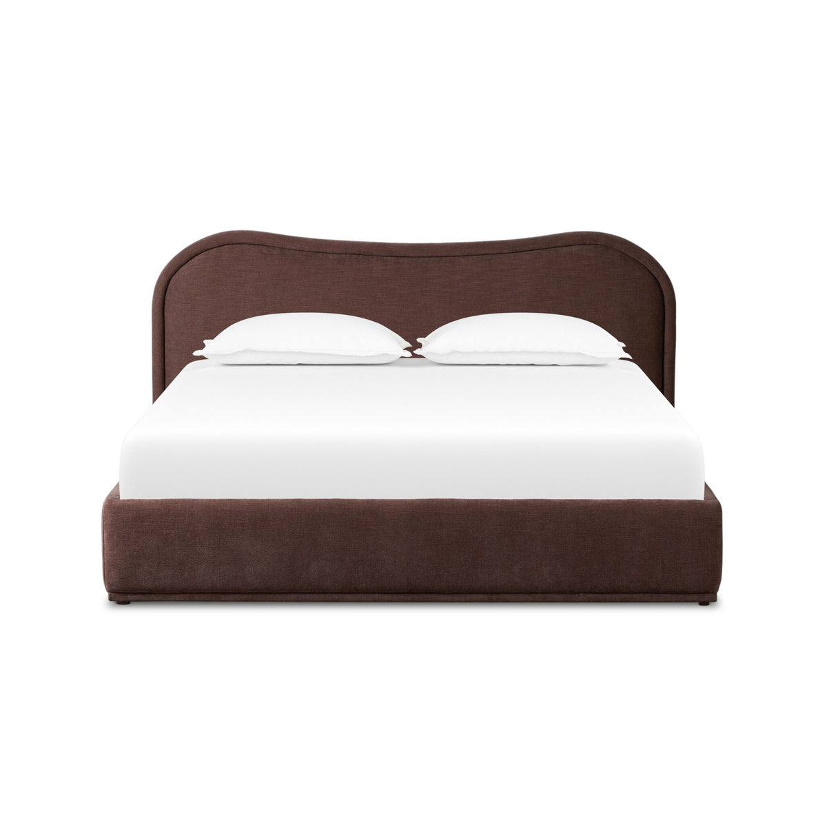 a bed with a white sheet and pillows