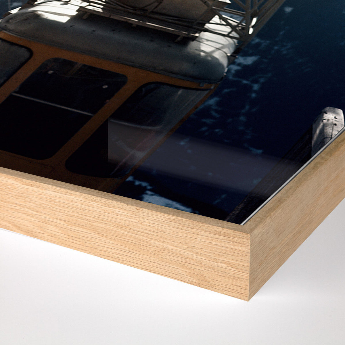 a wooden frame with a reflection of a boat