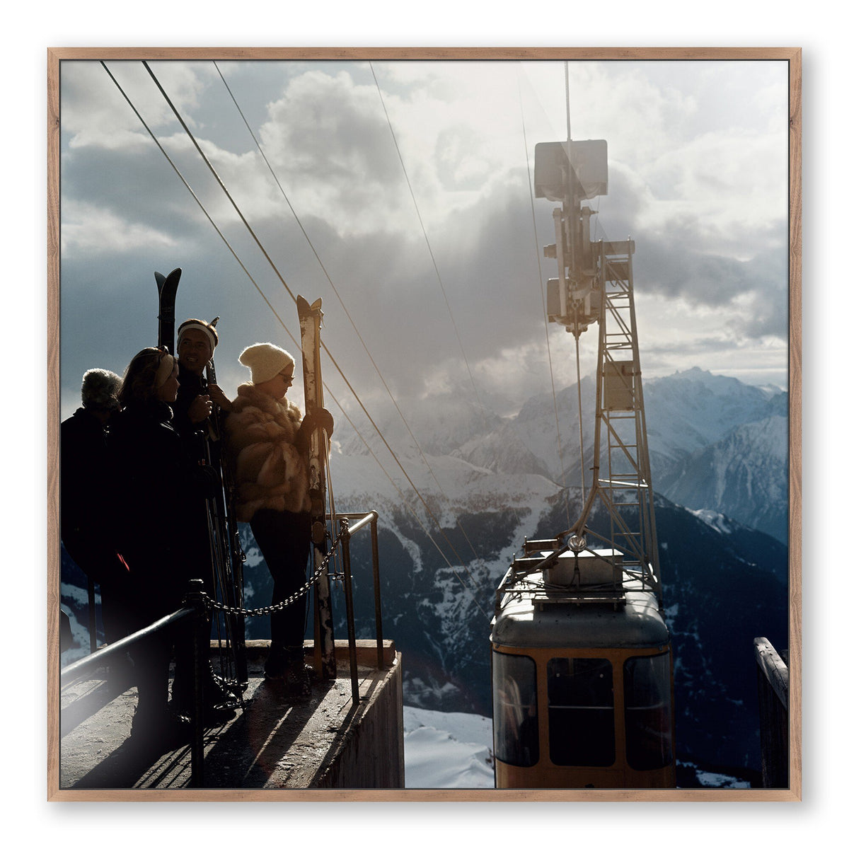 a group of people standing on a cable car