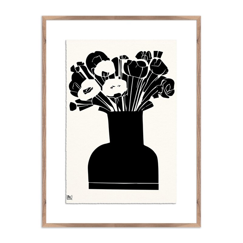 a black and white picture of flowers in a vase