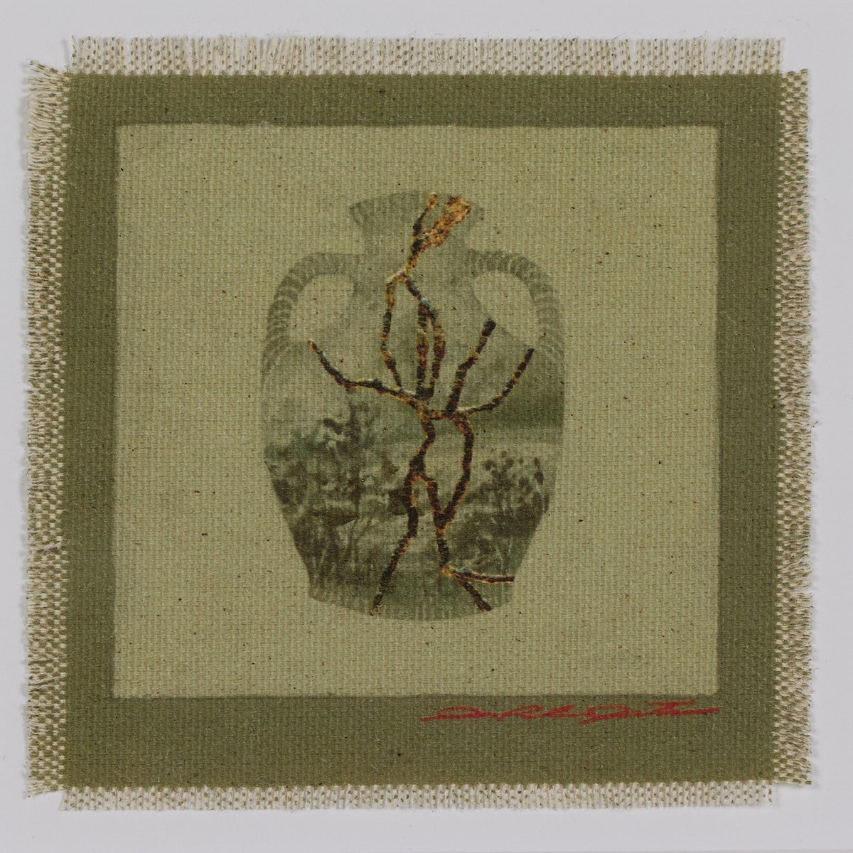 a piece of fabric with a vase on it