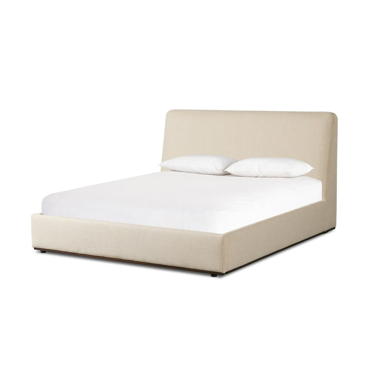 a bed with white sheets and pillows