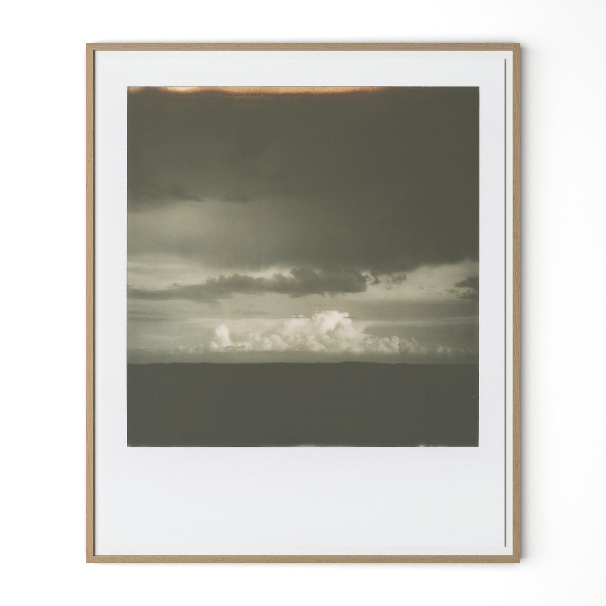 a picture frame with a cloudy sky