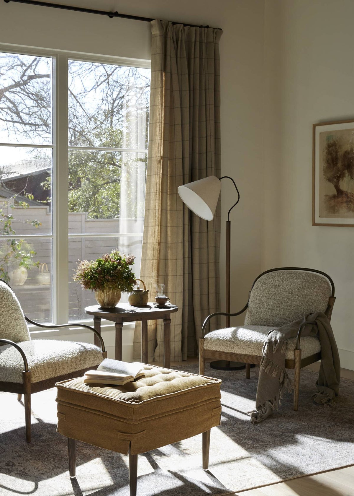 a living room with chairs and a table