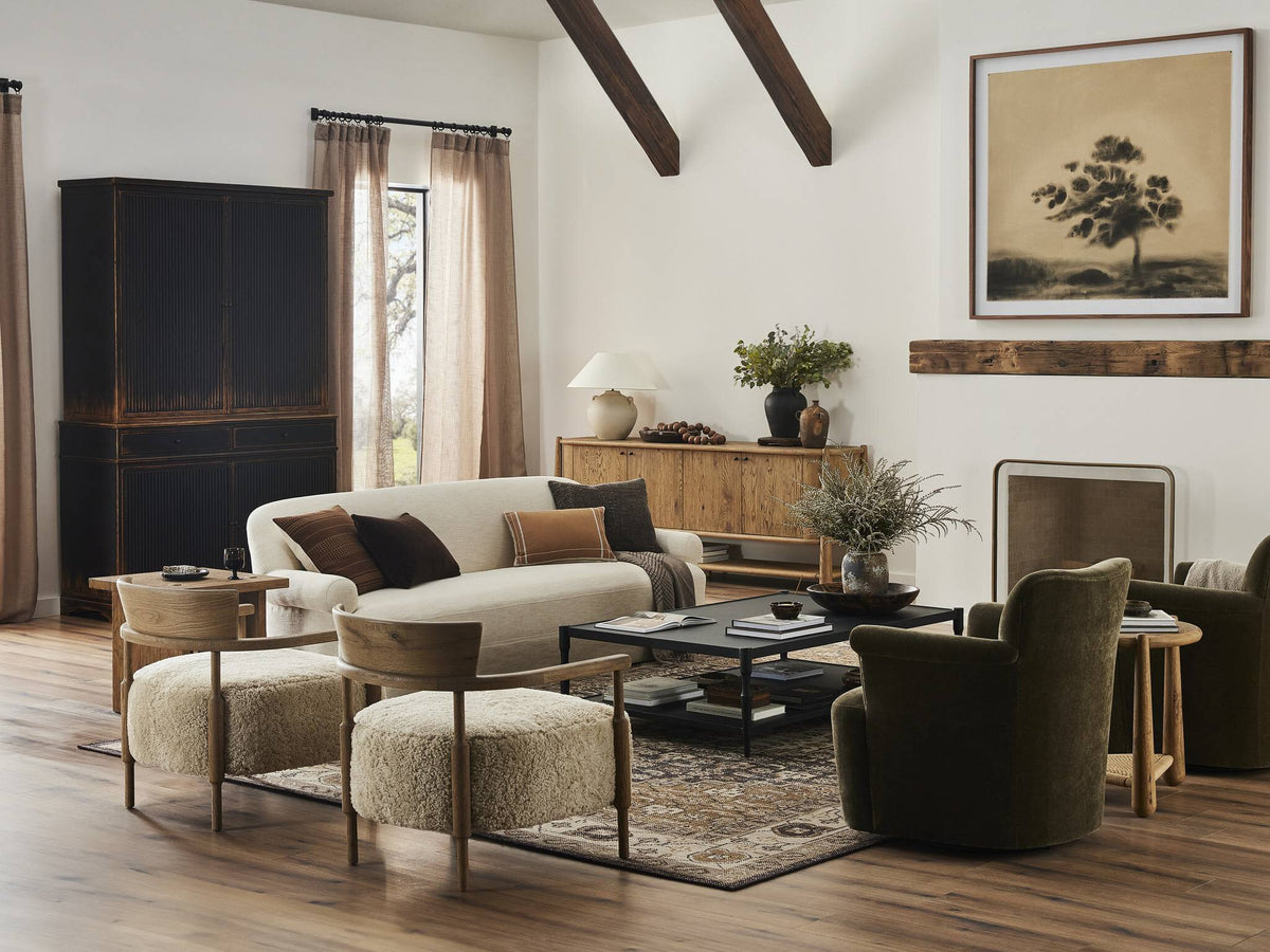a living room with a couch and chairs