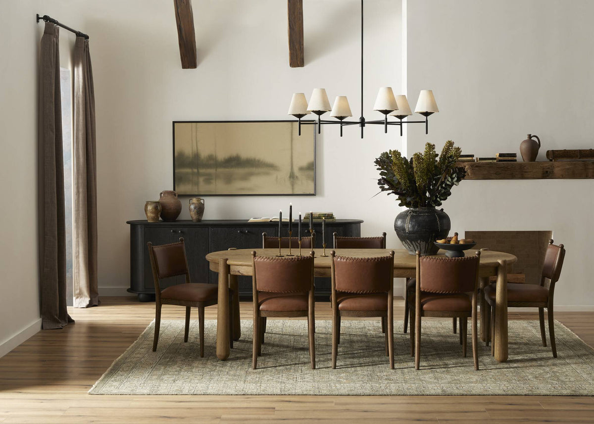 a dining room with a table and chairs