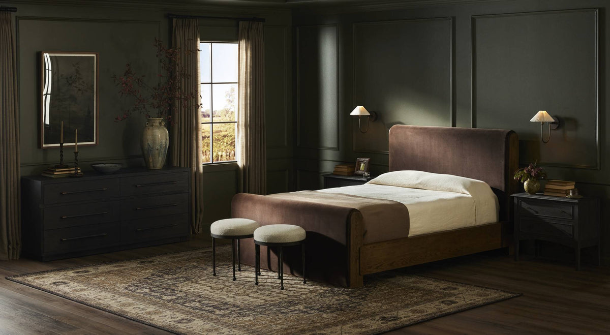 a bedroom with a bed and a rug