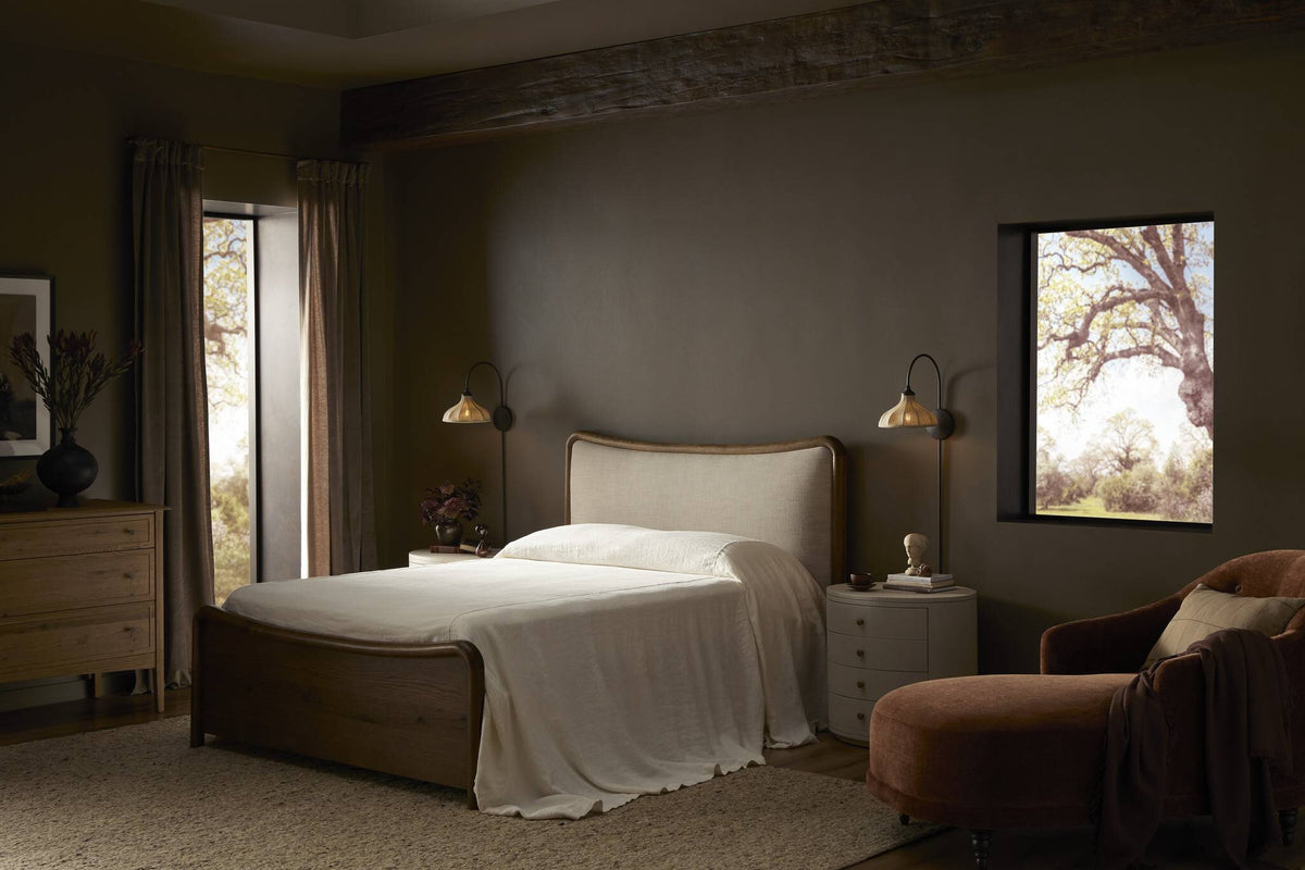 a bed in a room with a window