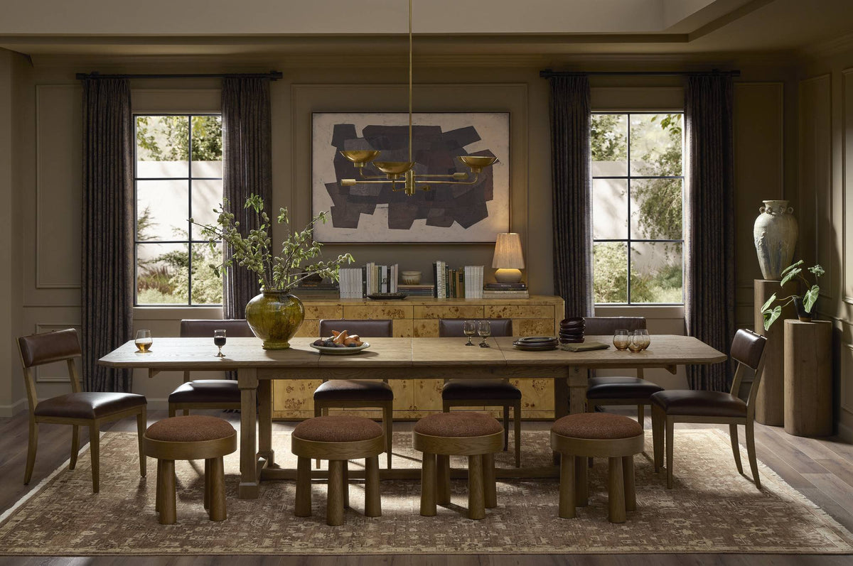 a dining room with a table and chairs