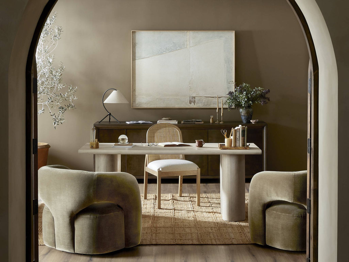 a room with a desk and chairs