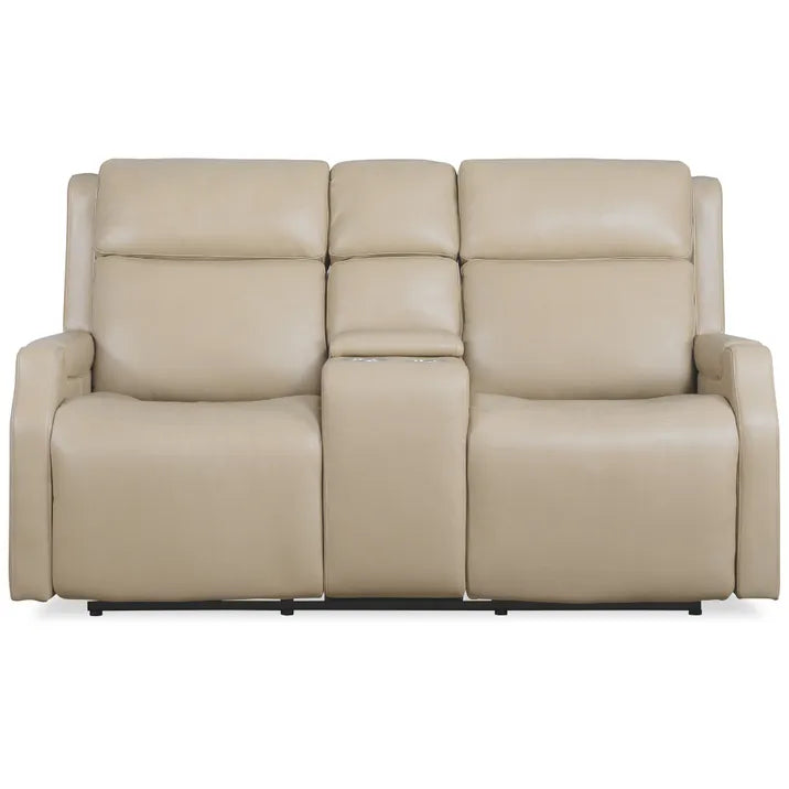 a tan leather couch with two reclining seats