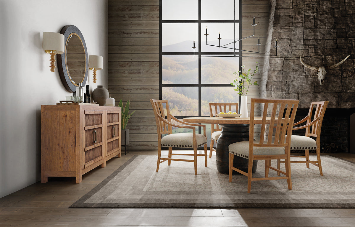 a dining room with a table and chairs