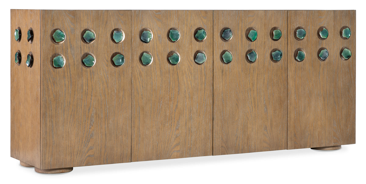 a wooden board with green stones