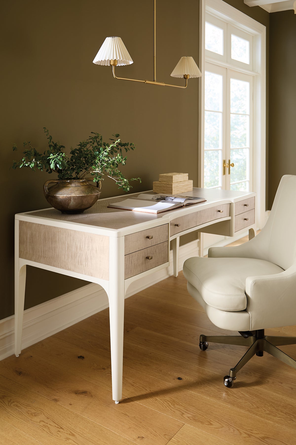 a desk with a plant in a pot
