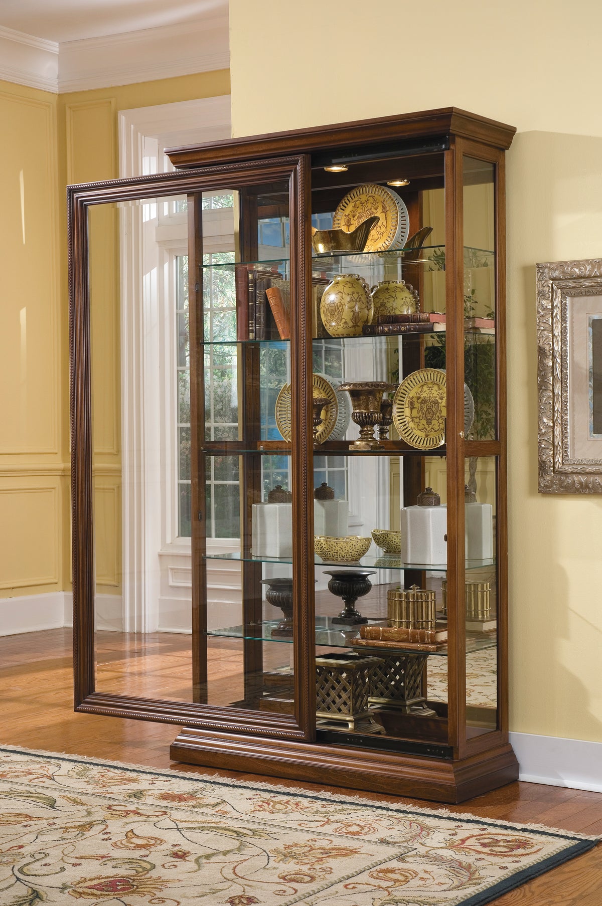 a glass cabinet with a wood frame
