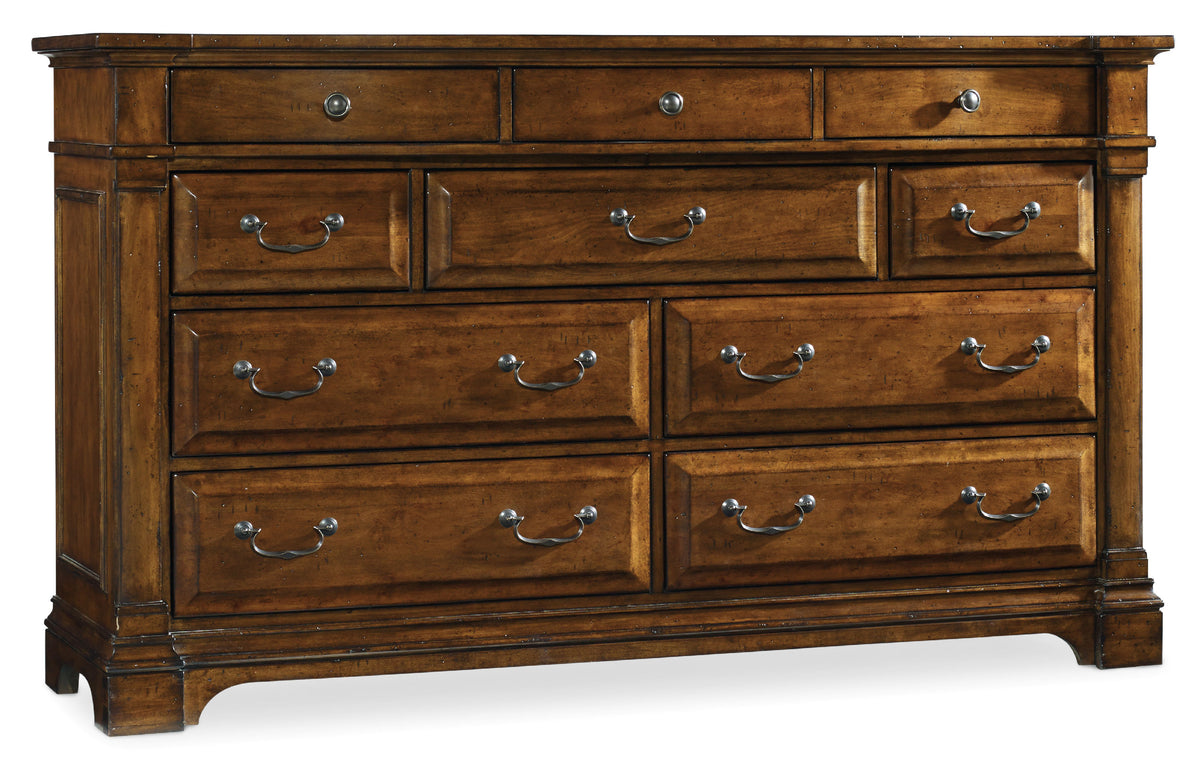 a wooden dresser with silver handles